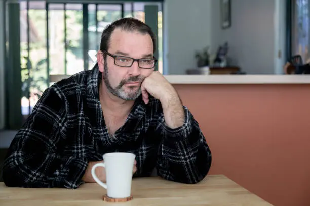Man feeling depressed going through a midlife crisis