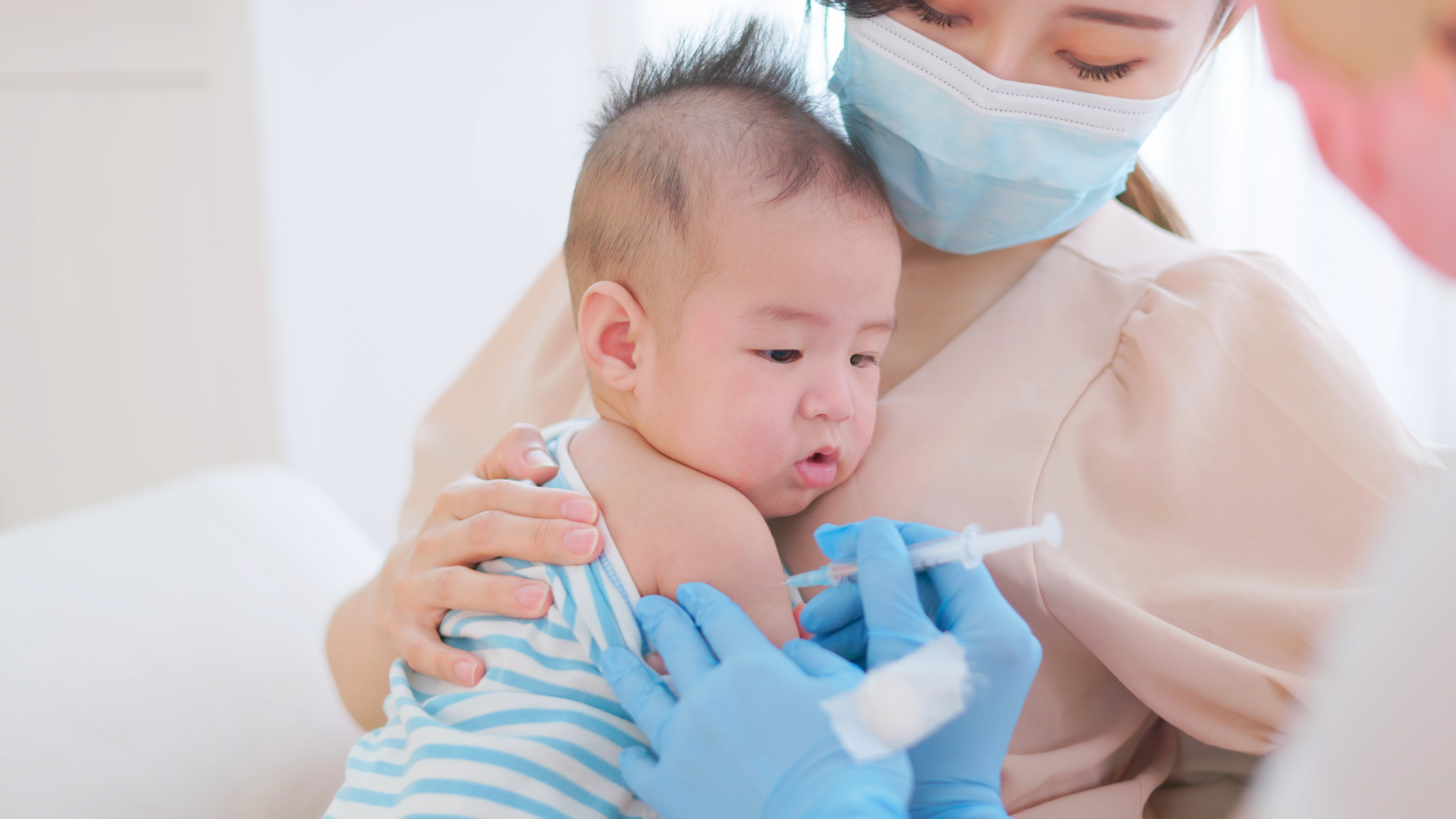 Baby getting a vaccine.