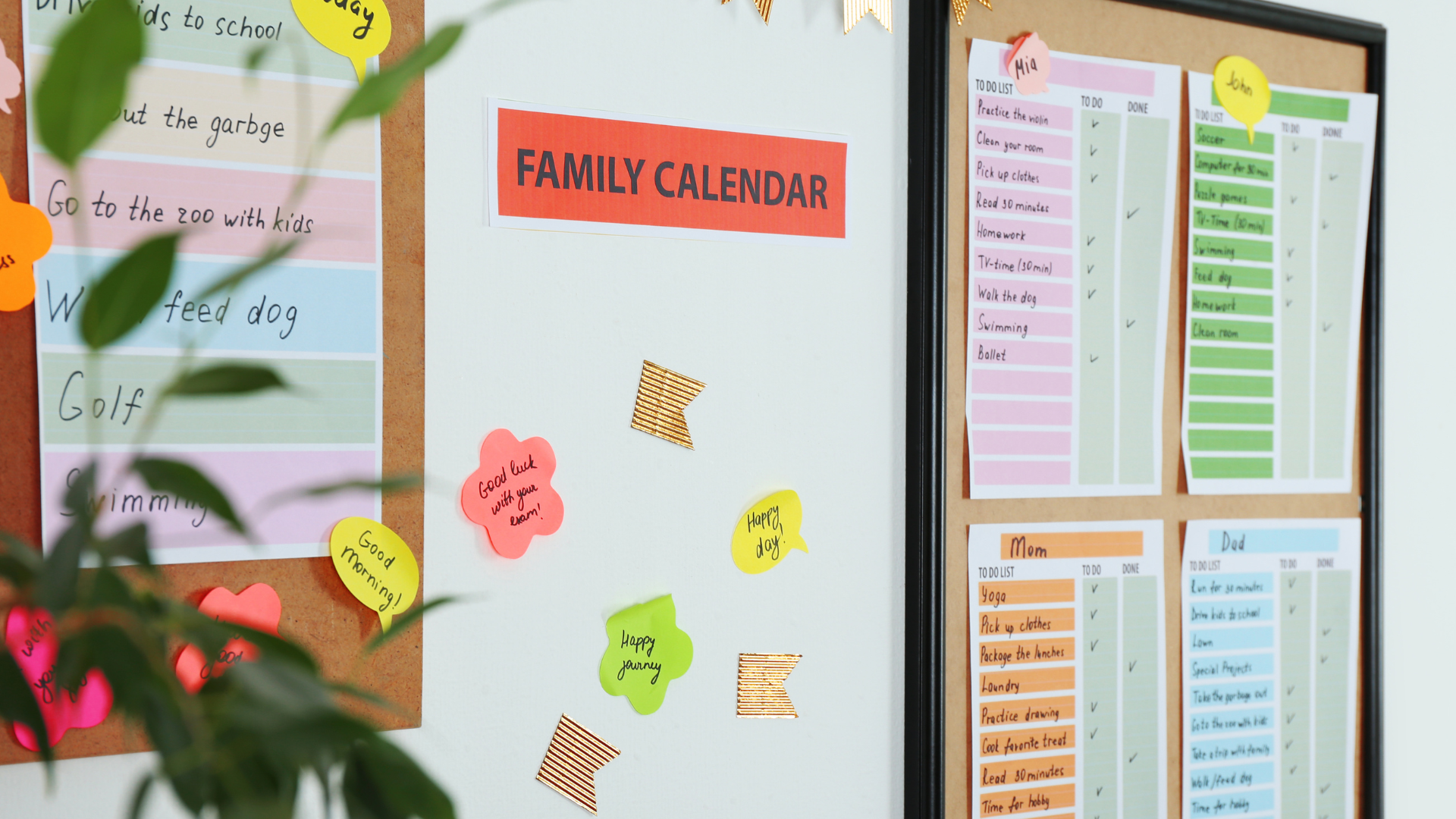 A family calendar with sticky notes and papers all over, indicating a busy family schedule.