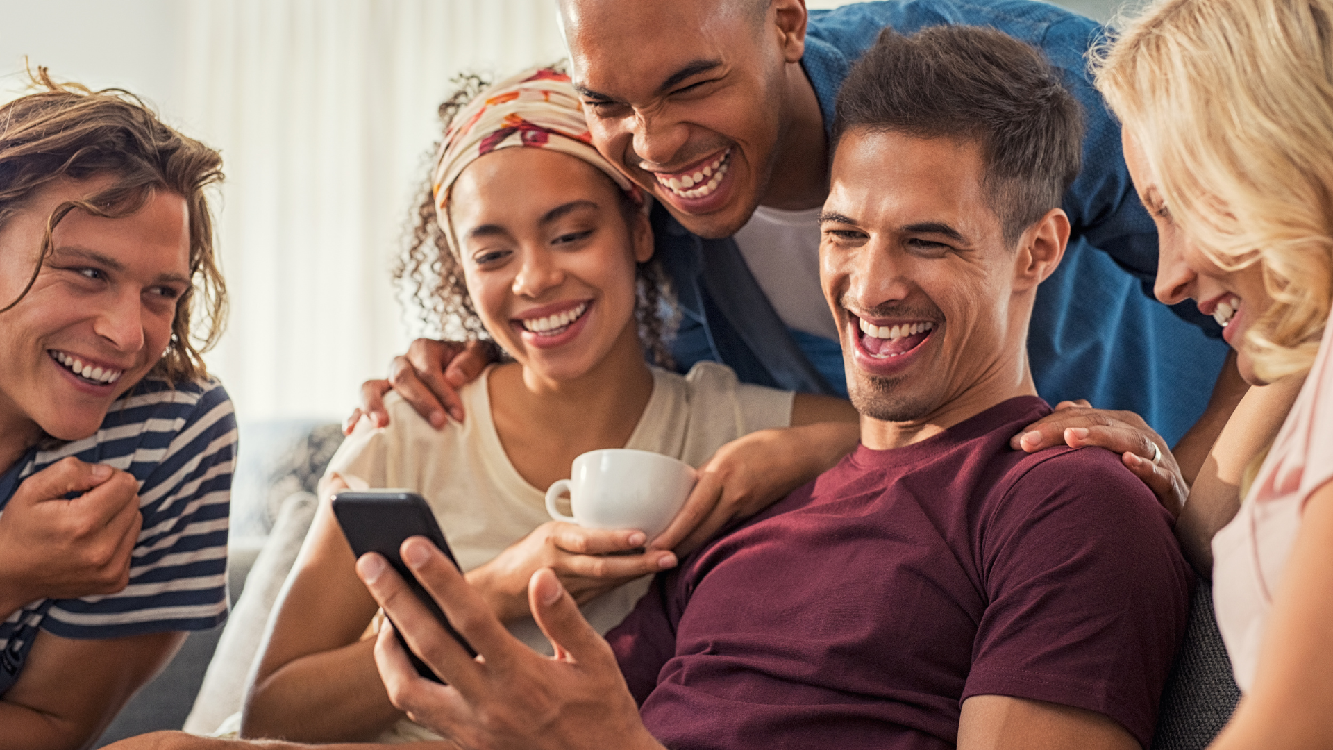 Untitled design (22) Friend reminiscing and laughing together, improving their mental health through humor.