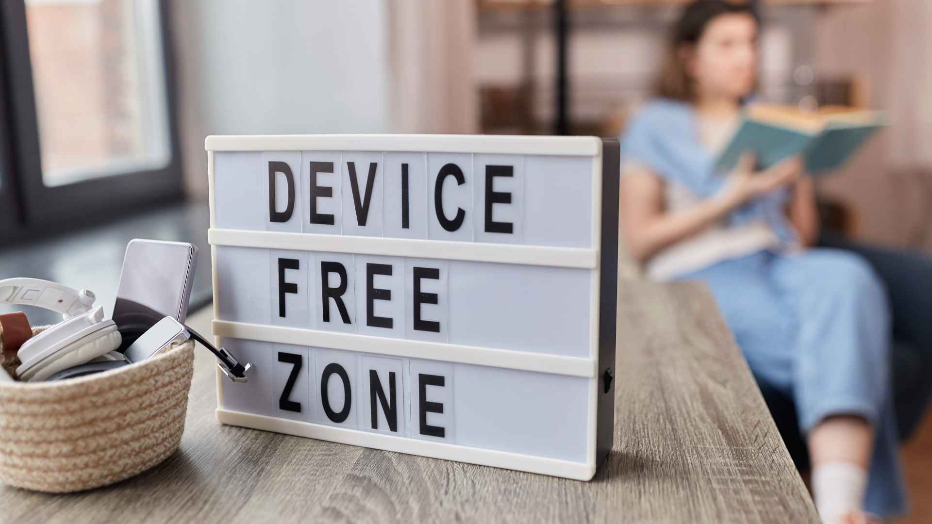 A sign depicts a device-free zone, which promotes a digital detox.