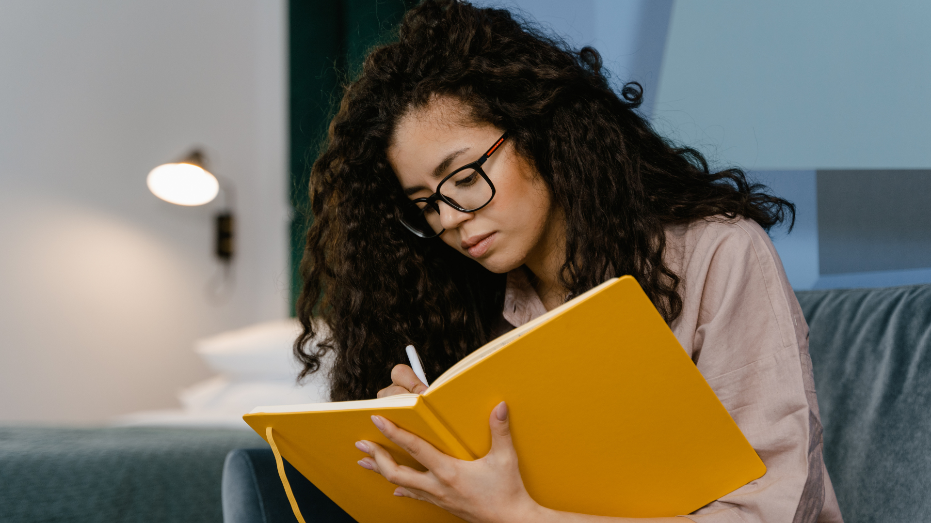 A woman journals, to reduce the negative effects of her quarterlife crisis.