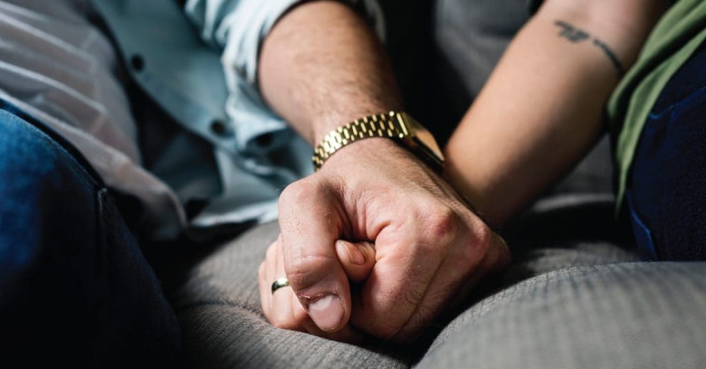 supportive friends holding hands