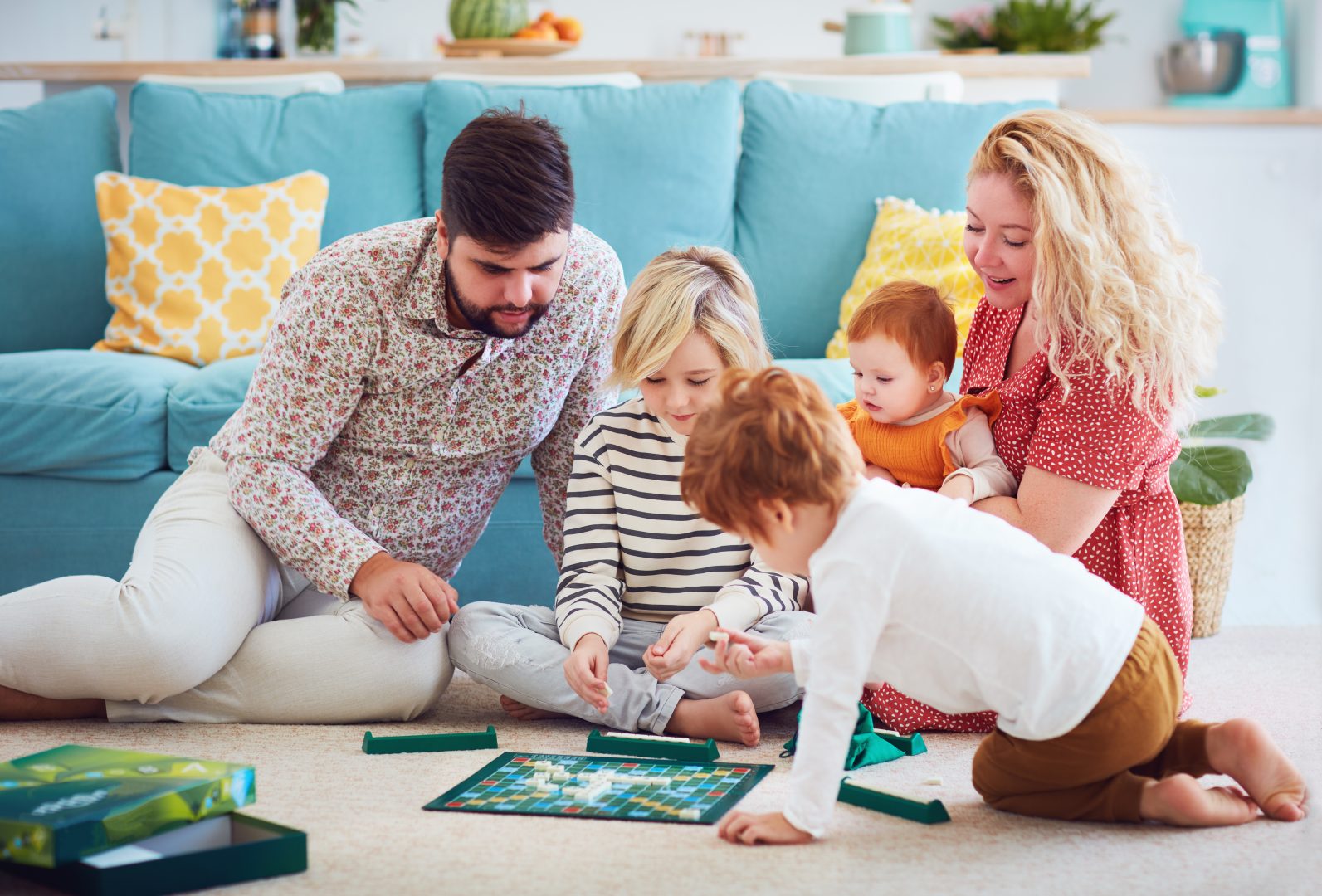 happy family playing board games together at home