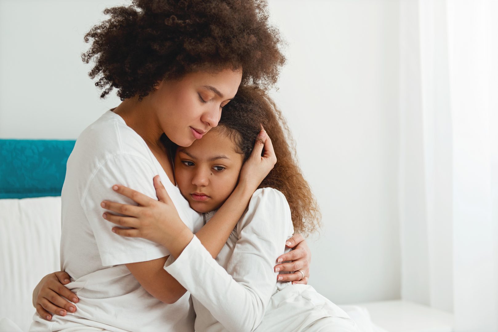 how to de escalate a crisis with your teen mother comforting her young daughter