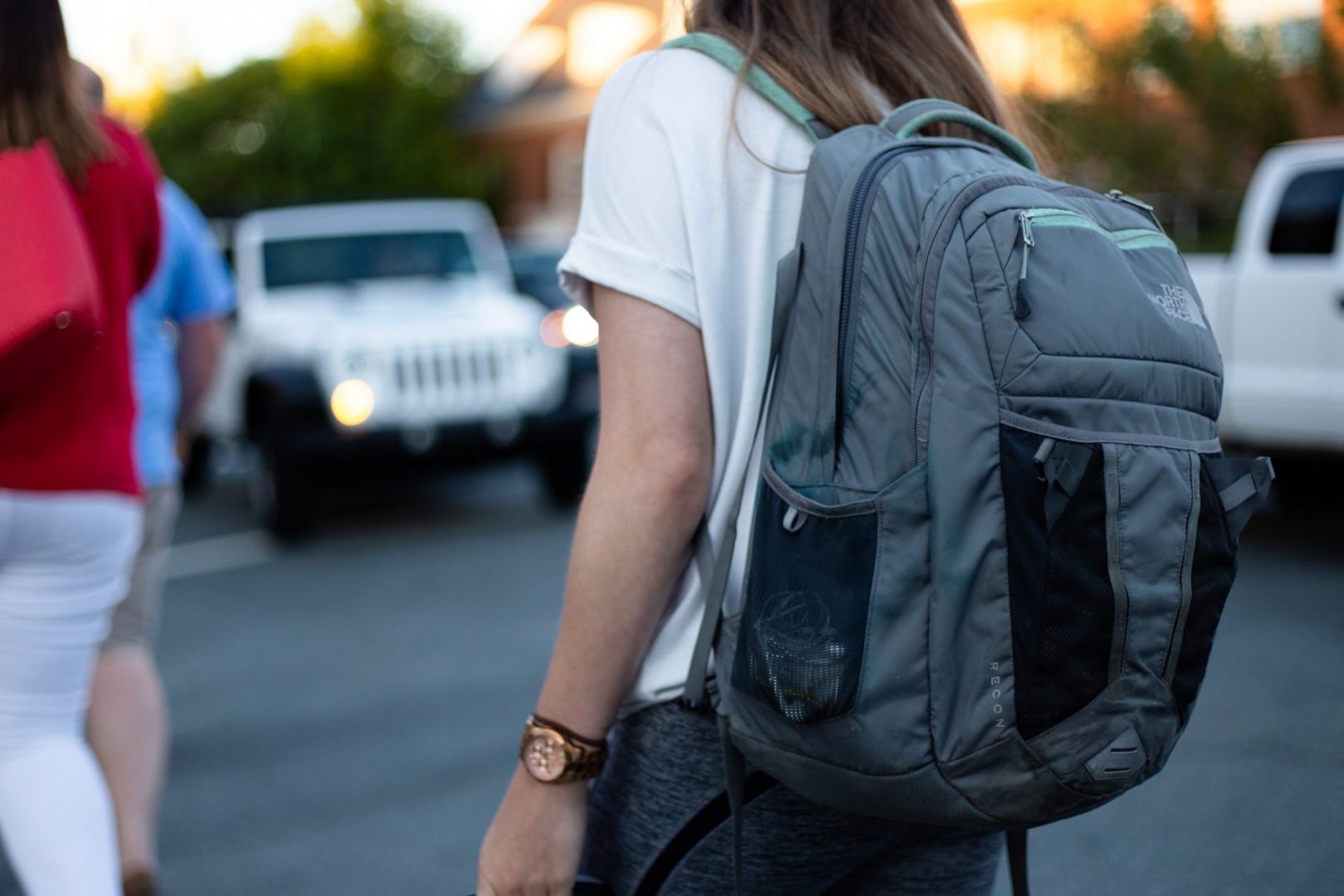 young girl wearing backpack for school