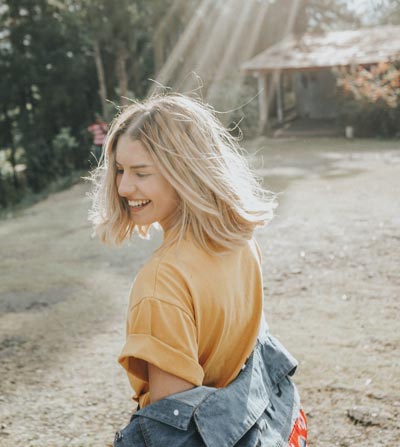 girl laughing in the sun seasonal affective disorder