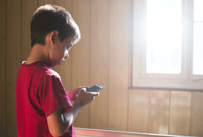 young boy with cell phone