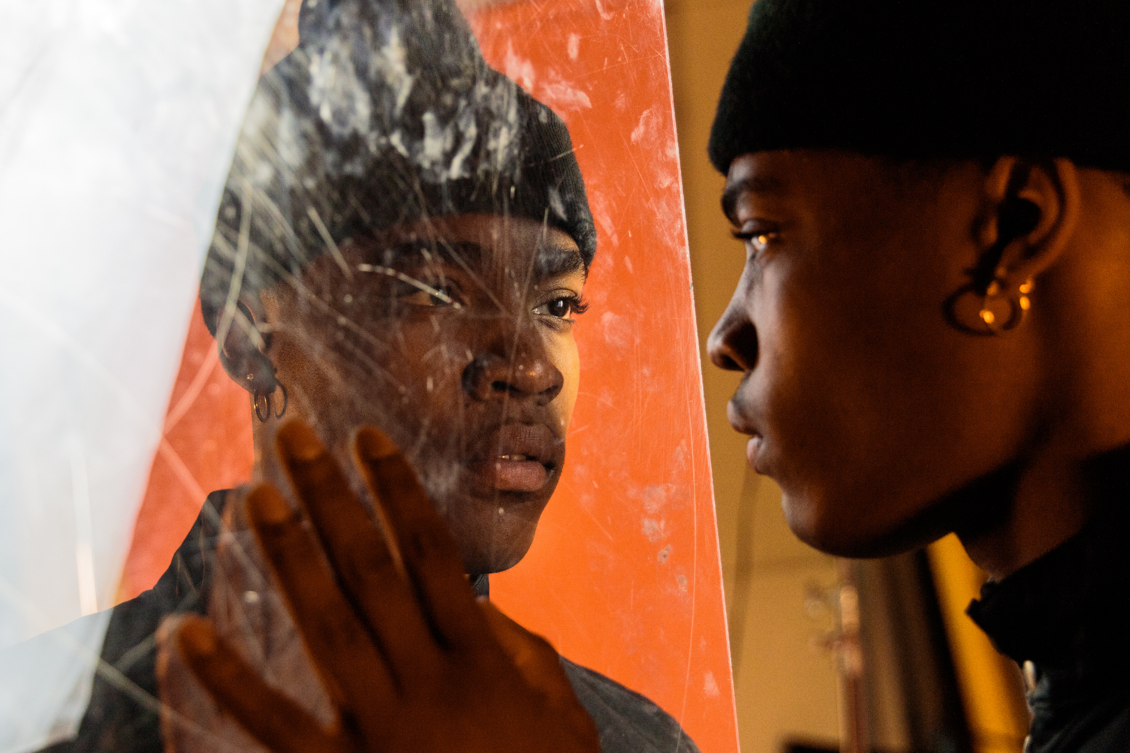 young black man looking in mirror negative self-talk