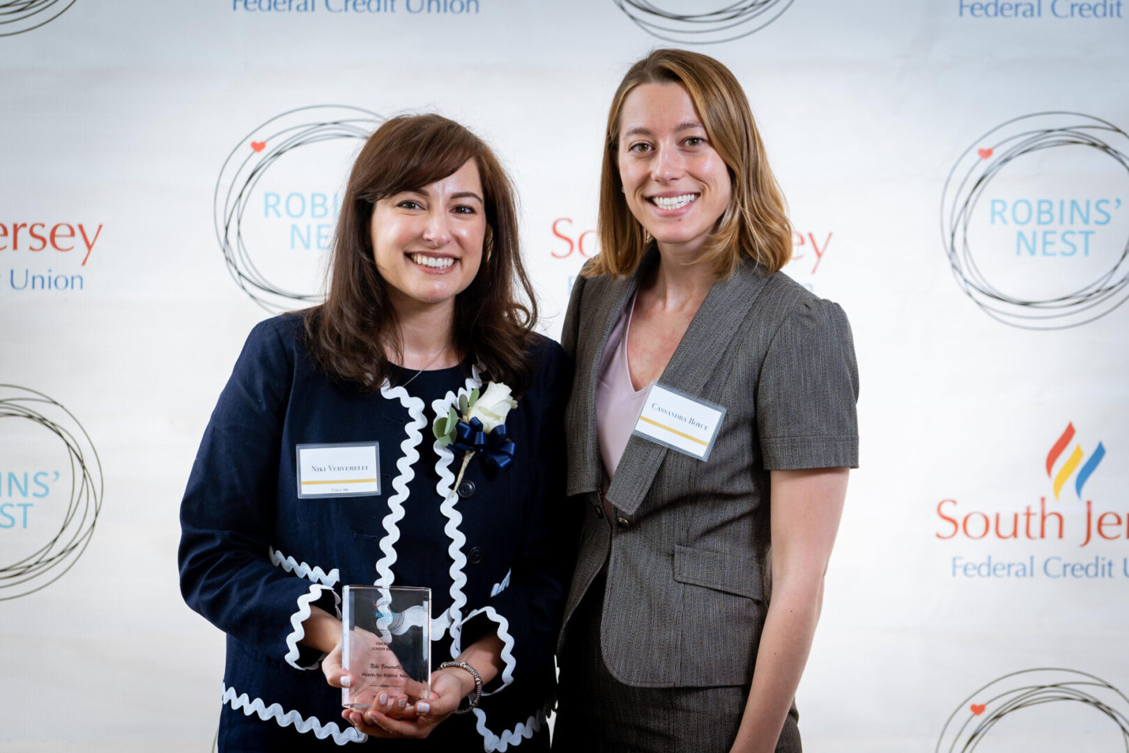 Niki Ververelli-Diamond poses with 2019 Emerging Leader Award at the 2019 Hearts for Robins' Nest Event