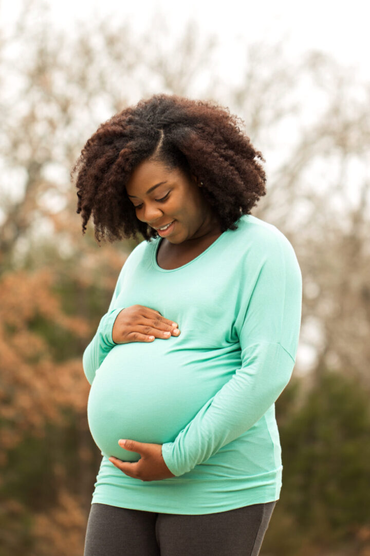 pregnant young black woman smiling pregnancy