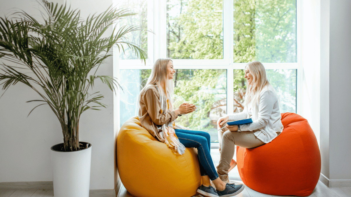 a woman being proactive about her mental health, talking with a therapist