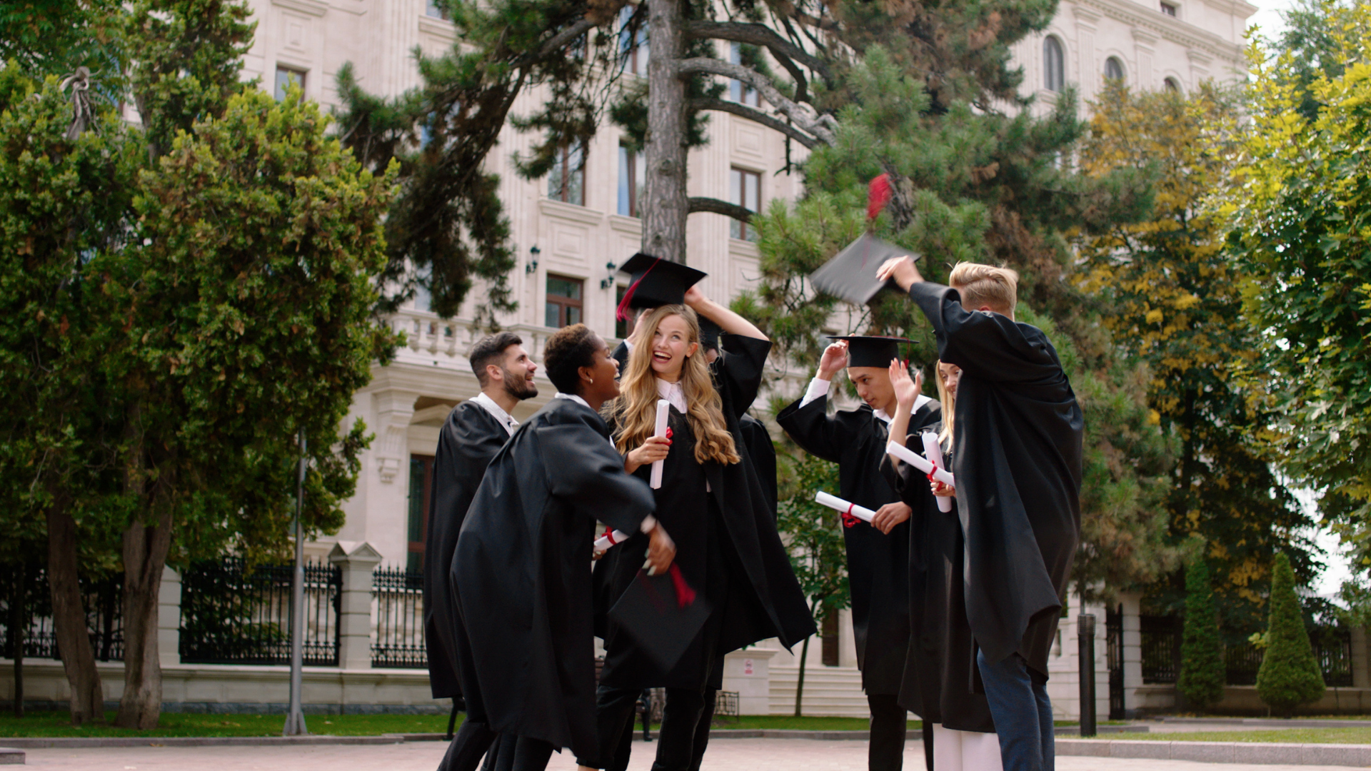 college students taking graduation photos