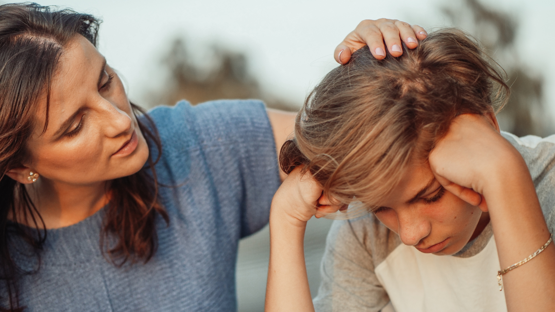 A parent comforts and encourages her child as he struggles with the process of substance use recovery.