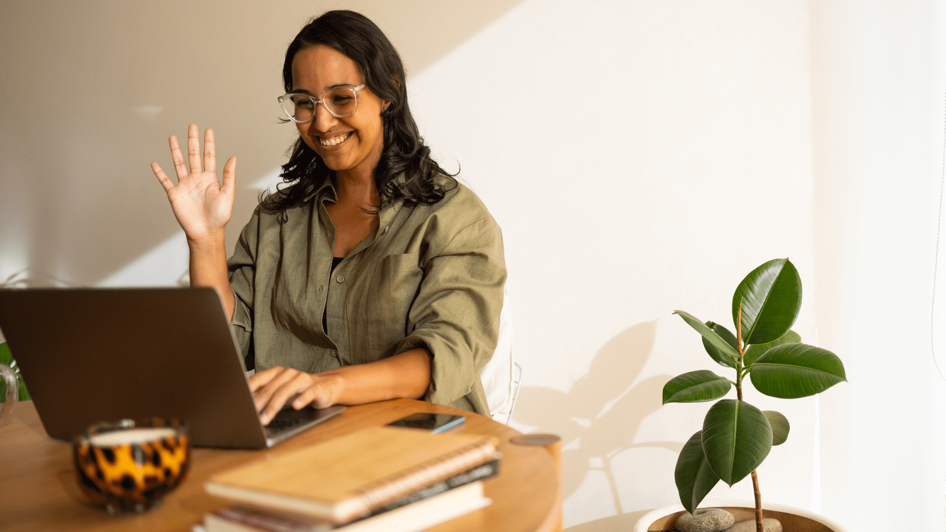 A woman connects with her therapist over a video call, rather than turning to AI.