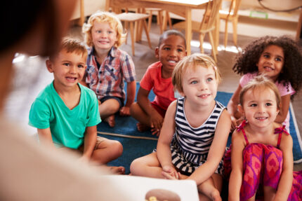 Preschool children during story time in their classroom.