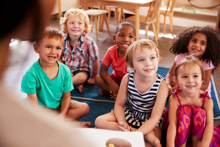 Preschool children during story time in their classroom.